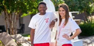 male and female lifeguard smiling